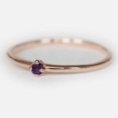 Engagement Ring Details14k Solid Rose Gold (Also available in White and Yellow Gold, Please select at checkout) 1.5mm (Approximate Band Width) Amethyst (Center Stone)Round 1.9mm (Center Stone Dimensions)0.03 Carats (Average Center Stone Weight)Ring can be resized from 3-10, Metal can be made in 14, 18K/ White, Yellow and Rose Gold.For custom order this ring with a different stone, please contact us.- - - SHIPPING POLICY - - - This ring is made to order, please allow 7-10 business days for proces Gemstone Midi Promise Ring In Fine Jewelry Style, Dainty Solitaire Sapphire Ring, Dainty Rose Gold Amethyst Promise Ring, Amethyst Solitaire Birthstone Ring, Round Cut, Amethyst Solitaire Birthstone Ring, Amethyst Birthstone Ring Solitaire Round Cut, 14k Gold Amethyst Solitaire Ring, Dainty Crystal Ring With Round Cut Birthstone, Dainty Birthstone Crystal Ring In Round Cut