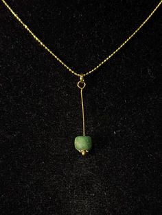 This elegant necklace features an authentic ancient Roman glass bead, dating back to the 1st-3rd century AD. The bead, with its striking green hue creates a timeless piece of wearable history. Origin: Roman Empire, 1st-3rd Century AD Material: Green glass bead, gold wire Roman glass was highly prized for its unique colors and craftsmanship, and this piece exemplifies the Roman mastery of glassmaking. The soft green bead has aged beautifully, showing subtle iridescence as a result of centuries of Roman Jewelry Ancient, Ancient Roman Jewelry, Roman Jewelry, Empire Romain, Ancient Roman Glass, Glass Beads Jewelry, Ancient Beauty, Roman Glass, Elegant Necklaces