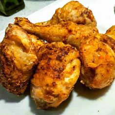 some chicken wings on a white plate