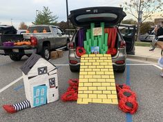 the trunk of a car is decorated with lego blocks and other items in front of it