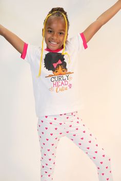 ABOUT THIS ITEM Celebrate natural beauty and self-confidence with our "Curly Head Cutie" pajama set – a delightful ode to embracing one's uniqueness in the most adorable way. This set isn't just sleepwear; it's a declaration of self-love, positivity, and the joy of being authentically you. Imagine your little ones slipping into this charming ensemble. The pajama top features a heartwarming illustration of a curly-haired girl, each radiating with confidence and charm. As they don their pajamas, t Heartwarming Illustration, Curly Head, The Joy Of Being, Cuffed Pants, Cotton Pyjamas, Pajama Top, Kids Sleepwear, Pair Of Pants, Knit Cuff