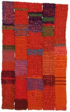 an orange and purple patchwork rug with many different colors on it's sides