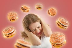 a woman holding her head in front of hamburgers with the caption when you try to go on a diet