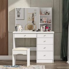 a white dressing table with a mirror and stool