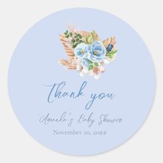 a blue and white thank sticker with flowers on it's side, in the shape of an angel