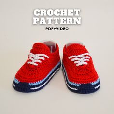 a pair of crocheted red shoes with blue and white laces on them