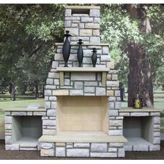 an outdoor fireplace with vases on it in front of a painting of trees and grass