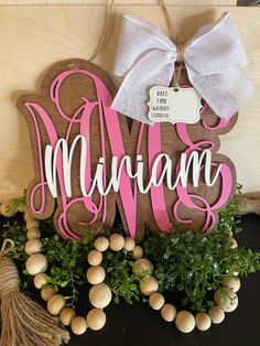 a wooden sign with the word mama on it