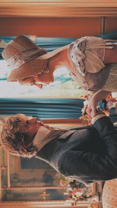 a man and woman standing next to each other