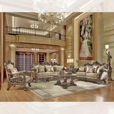 a fancy living room with chandelier and couches in the middle of it