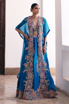 Blue lehenga with resham, zardosi and pearl embroidery in floral paisley pattern. Paired with a sleeveless embroidered blouse and floral paisley cutwork embroidered cape. - Aza Fashions Cape Set, Embroidered Cape, Blue Lehenga