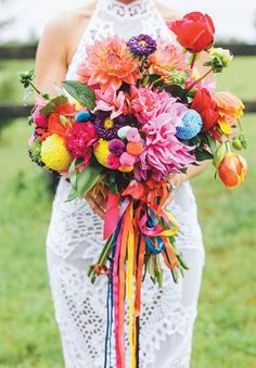 a woman holding a bouquet of flowers on her wedding day with the google logo in the background