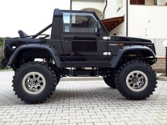 a black jeep parked in front of a building