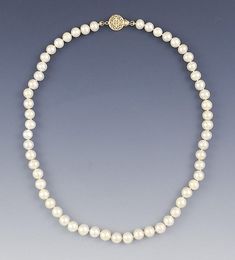 Presented is a classic strand of pearls with a 14 karat gold clasp. The pearls measure about 7.5-8 millimeters in diameter. The clasp is done in a beautiful textured openwork design. The clasp has a tongue insert style clasp with a safety mechanism for added security. This necklace is in great condition. The pearls have some irregularities here and there, but are overall very nice. The clasp functions well and closes securely. The strand is individually knotted for additional security. Both part Classic Yellow Gold Pearl Necklace With Charm, Classic Yellow Gold Pearl Drop Necklace, Classic Gold Pearl Necklace, Classic Single Strand Pearl Necklace With Round Beads, Classic Yellow Gold Pearl Necklace, Classic Single Strand Pearl Necklace, Classic Single Strand Round Pearl Necklace, Classic Single Strand Pearl Necklace For Formal Occasions, Classic Pearl Necklace With Round Beads For Anniversary