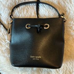 Black Leather Kate Spade Bucket Bag. No Scratches Or Wear On Outside Of Bag. Just Some Marks Inside But I Think They Can Be Cleaned Off Easy. Purchased Brand New, Only Used For A Short Period Of Time And Been Sitting In My Closet. Smoke Free Pet Free Home. Kate Spade Black Pouch Shoulder Bag, Black Kate Spade Bag With Adjustable Strap, Kate Spade Bags With Metal Hardware For Everyday Use, Bags Kate Spade, Leather Bucket Bag, Leather Bucket, Kate Spade Bags, Bucket Bag, Kate Spade