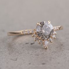 an engagement ring with two pear shaped diamonds