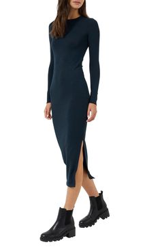 Daring side slits update the staple silhouette of this midi sweater dress sure to get compliments. 47" length Crew neck Long sleeves Slips on over head 53% viscose, 42% polyester, 5% elastane Machine wash, line dry Made in Turkey Model Stats: 5'10" height; 34" bust; 27" waist; 35" hips. Casual Long Sleeve Dresses With Side Slits, Chic Stretch Midi Dress With Side Slits, Fitted Longline Fall Dresses, Winter Midi-length Bodycon Sweater Dress, Casual Long Midi Dress With Side Slits, Midi Bodycon Dress With Side Slits, Fitted Bodycon Dress With Side Slits And Split Hem, Fitted Ribbed Midi Dress, Winter Bodycon Midi Sweater Dress