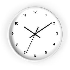 a white clock with black hands and numbers on the face is shown against a white background