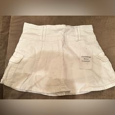 This Is A Brand New Skirt No Flaws. It States That It’s A Size Small. But It Does Run Very Small, So It Is More Like An Extra Small. Have A Cute Little Flair On The Bottom And Shorts Underneath. Super Cute. White High Waist Y2k Mini Skirt, Trendy Non-stretch Mini Skirt With Pockets, Y2k High Waist Skort With Pockets, Trendy High Waist Skort, Y2k Denim Skirt With Pockets, Non-stretch Short Skirt With Pockets, Short Non-stretch Skirt With Pockets, Fitted Skirt With Built-in Shorts For Day Out, Non-stretch Cotton Mini Skirt With Pockets