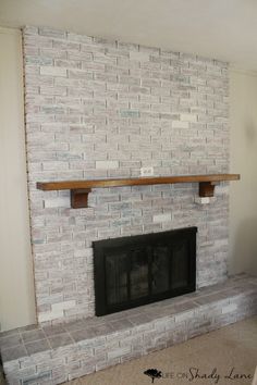 a brick fireplace with some shelves above it