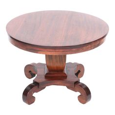 a small wooden table with two legs and a round top on one end, sitting against a white background