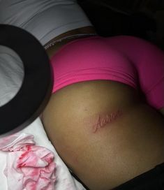 a pregnant woman's stomach with the word mom written on it in cursive font