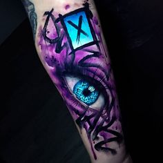 an eye with purple and blue paint on it's arm is shown in this image