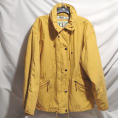 Beautiful J.L.C. Vintage Light Yellow Oversized Coat With A Zipper And Snap Button Closure! Made In Hong Kong! Has A Hidden Grey Hood!! Perfect For Fall Or Winter Days! Has Just Not Been Worn Lately And Hanging Around So It's Time For Someone Else To Enjoy This Beautiful Coat A While! Measurements Laying Flat: Pit To Pit: 25 1/2". Length: 29 1/2". Sleeve Length: 23". Smoke And Pet Free Home! Reasonable Offers Always Welcome! Yellow Winter Outerwear With Button Closure, Yellow Oversized Hooded Outerwear, Yellow Winter Parka With Pockets, Yellow Hooded Parka With Pockets, Oversized Yellow Outerwear For Fall, Mustard Oversized Outerwear For Spring, Yellow Oversized Outerwear For Fall, Casual Yellow Parka For Fall, Casual Mustard Cotton Outerwear