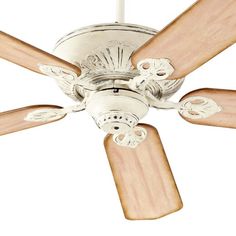 a white ceiling fan with wooden blades on it's blade and light wood blades