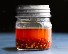 a jar filled with liquid sitting on top of a table