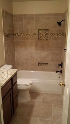 a bathroom with a toilet, sink and bathtub