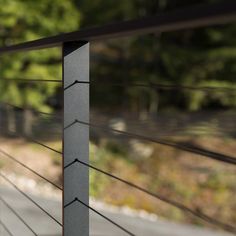 a close up view of a metal fence with wood slats on the top and bottom