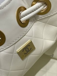 SHOP MORE LUXURY PRODUCTS HERE Description Chanel Small Drawstring Bucket White Bag For Women 19cm/7.5in Size: 19 x 15 x 12.5 cm / 7.5 x 6 x 5 in Golden MetalCC logoWhite Includes dust bag.This product is of the premium quality. Tote Bag Chanel, Dior Bucket Hat, Chanel Tote Bag, Gucci Shirt, Louis Vuitton Shirt, Chanel Shirt, Chanel Tote, Chanel Belt, Luxury Products