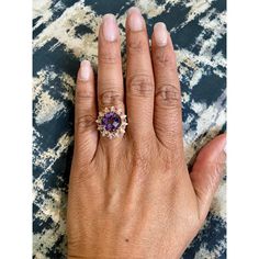 Amethyst, Pink Sapphire, and Diamond Cocktail Ring!  Playful yet Powerful! Its like having a piece of glittery candy on your finger! This ring has a Checkers Round Cut Amethyst that weighs 4.90 Carats and is embellished with alternating 12 Pink Sapphires that weigh 0.28 Carats and 12 Round Cut Diamonds that weigh 0.20 Carats. (Clarity: SI2, Color:F) The total carat weight of the ring is 5.38 Carats.  The ring is crafted in 14 Karat Yellow Gold and weighs approximately 4.8 grams. The ring is a si Yellow Gold Cocktail Ring, Diamond Cocktail Ring, Gold Cocktail Ring, Gold Cocktail, Diamond Cocktail Rings, Sapphire Diamond, Ring Size 7, Cocktail Ring, Pink Sapphire