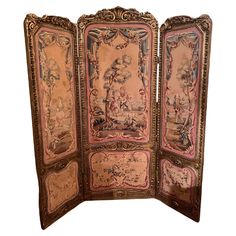 an ornately decorated room divider with paintings on it