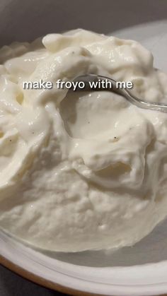 a spoon is in a bowl of yogurt that says make froy with me