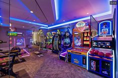 a room filled with arcade machines and neon lights