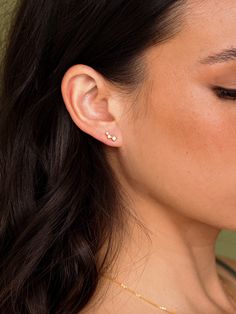 DESCRIPTION A dainty trio of gems all lined up and ready to shine. These subtle and easy-to-wear earrings bring a little extra luxe to your simplest studs. Dainty enough to pair with multiple piercings and just as cute on its own. Wear with: Tully Bracelet or Meja Pendant ✨ Vermeil Collection This demi-fine jewelry col Simple Diamond Earrings, Tennis Jewelry, Everyday Earrings Studs, Multiple Piercings, Minimalist Earrings Studs, Simple Stud Earrings, Mini Earrings, Minimal Earrings, Demi Fine Jewelry