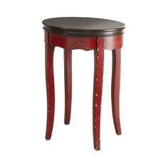 a small wooden table with red paint on the top and brown trim around the edge