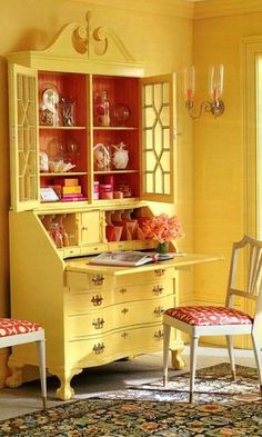 a yellow desk and chair in a room