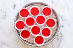 red cups sitting on top of a metal pan