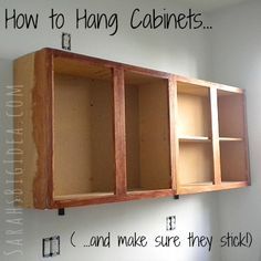 an unfinished kitchen cabinet is being built in the corner of a room with white walls