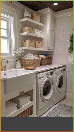 a washer and dryer in a small room next to a window with open shelving