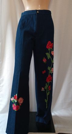 Vintage Blue Jeans with Rose Embroidery. Dark wash jeans, high rise waist. Slim seated, straight leg fit with no pockets. Snap button closure for the 1 inch waistband. Vibrant Pink hued rose buds and blossoms are embroidered vertically on the lower portion of each leg, drawing attention to the lovely creations while lengthening the legs. Bohemian/Flower Child look, perfect with peasant top. Tag says Size 9/10, fits more like Size 5/6. Petit Fors California. Petit Fors, Leg Drawing, Jeans With Embroidery, Jeans Drawing, Embroidery Pants, Flower Jeans, Rose Jeans, Bohemian Flower, Diy Embroidery Designs