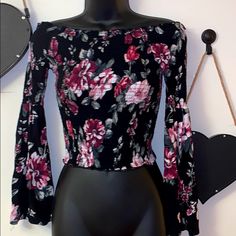 Pink And Black Off The Shoulder Top Size Extra Small Clubwear Dressy Date Night Long Sleeve Stretch Material Black Floral Print Stretch Tops, Black Stretch Top With Floral Print, Black Stretch Floral Print Tops, Black Stretch Tops With Floral Print, Pink Floral Print Top For Night Out, Fitted Black Floral Print Tops, Black Off The Shoulder Top, Turquoise Blouse, Leopard Blouse