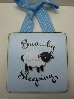 a blue and white sign that says baa bly lucas sleeping