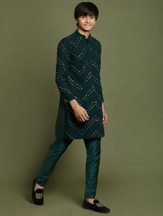 YUVA By VASTRAMAY Boys Green Mirror Work Georgette Kurta And Pyjama Set Dress your boy in style with this elegant kurta pyjama set featuring intricate mirror work. This set is perfect for festive occasions and special events. Key Features Green colored georgette fabric with mirror work embellishment Mandarin collar, long sleeves, and button placket kurta Comfortable pyjama with elasticated waistband Specifications Material: Kurta - Georgette, Pyjama - Viscose Sleeve Length: Long Material & Care Intricate Mirror, Georgette Kurta, Kurta Style, Green Mirror, Kurta Pyjama, Comfortable Pajamas, Green Mirrors, Boys Wear, Georgette Fabric