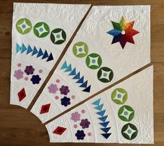 four quilts are arranged on top of each other in different colors and shapes,