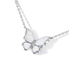 Add elegance to your outfit with this beautiful mother of pearl butterfly pendant. Crafted in sterling silver and adorned with mother of pearl and white stones, this necklace recreates the charm of the butterfly. It is ideal for all butterfly lovers.Carat Weight: 0.039 ctStone Size: 1.1,1.3 mmStone Type: Jeulia® StoneNumber of Stones: 3 Stone Shape: RoundStone Color: Diamond WhiteWeight: 4.03 gMaterial: 925 SilverPlating Color: SilverLength: 425 mm Luxury White Gold Butterfly Pendant Necklace, Elegant Sterling Silver Butterfly Necklace With Butterfly Clasp, Luxury Sterling Silver Butterfly Necklace, Luxury Silver Necklace With Butterfly Charm, Elegant Silver Butterfly Necklace With Charm, Elegant Silver Butterfly Necklace In Sterling Silver, Elegant Silver Butterfly Necklace, Luxury White Gold Butterfly Necklace, Elegant Butterfly Charm Pendant Necklace