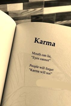 an open book with the words karma written in black and white on it's cover